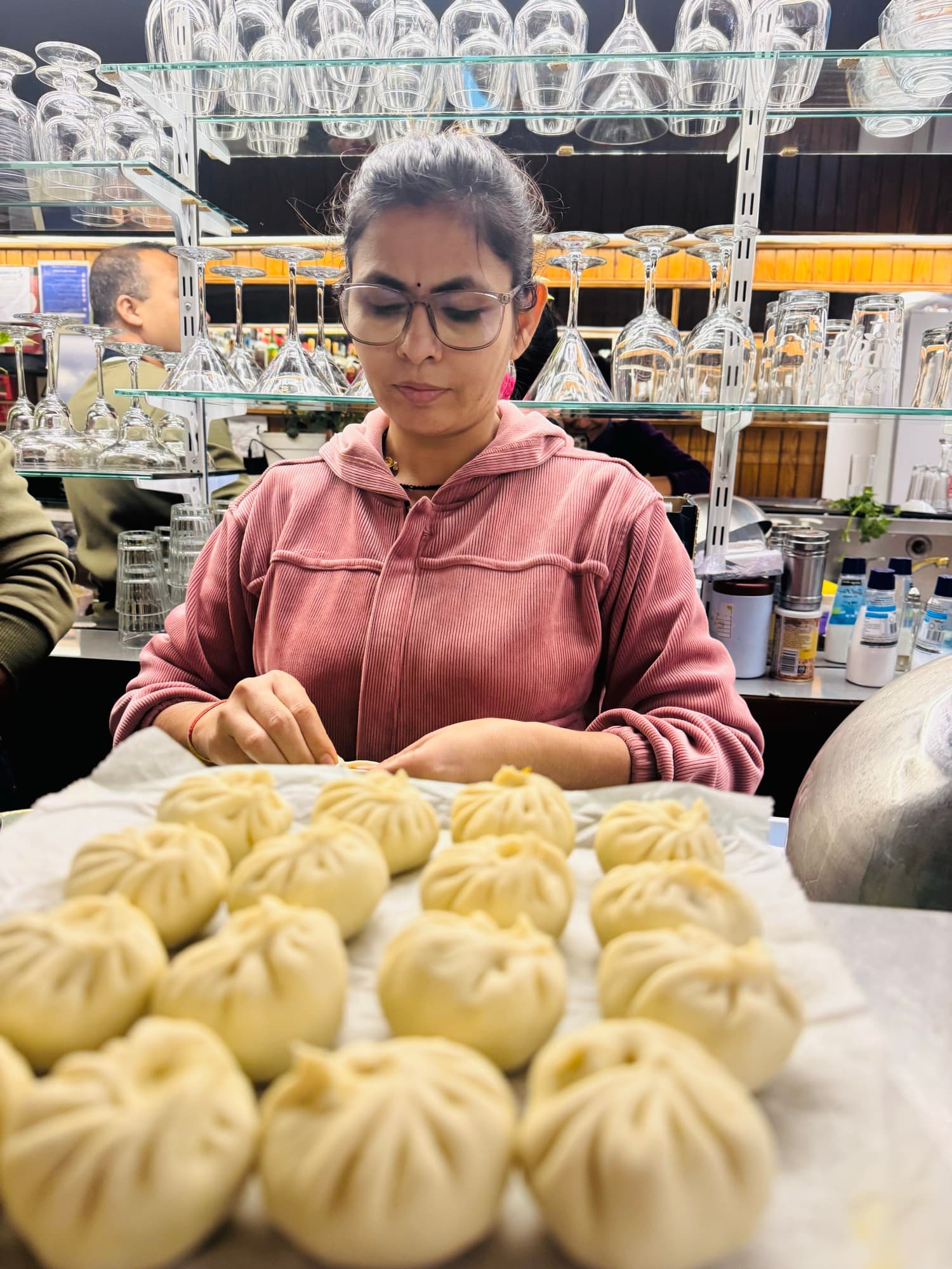 Eurasia staff hand-folding momo dumplings